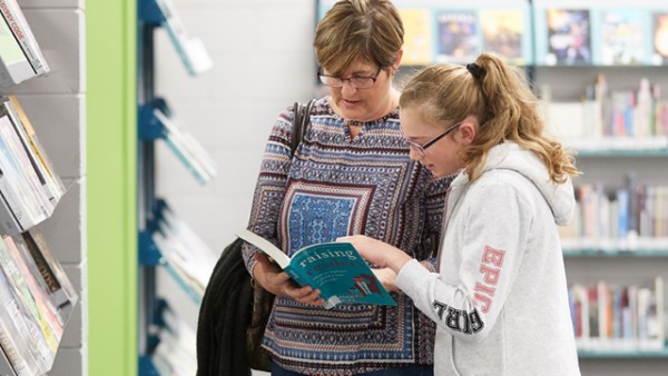 Mother and daughter reading together