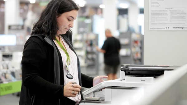 Librarian using a scanner