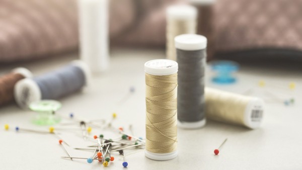 Needles, pins, and spools of thread